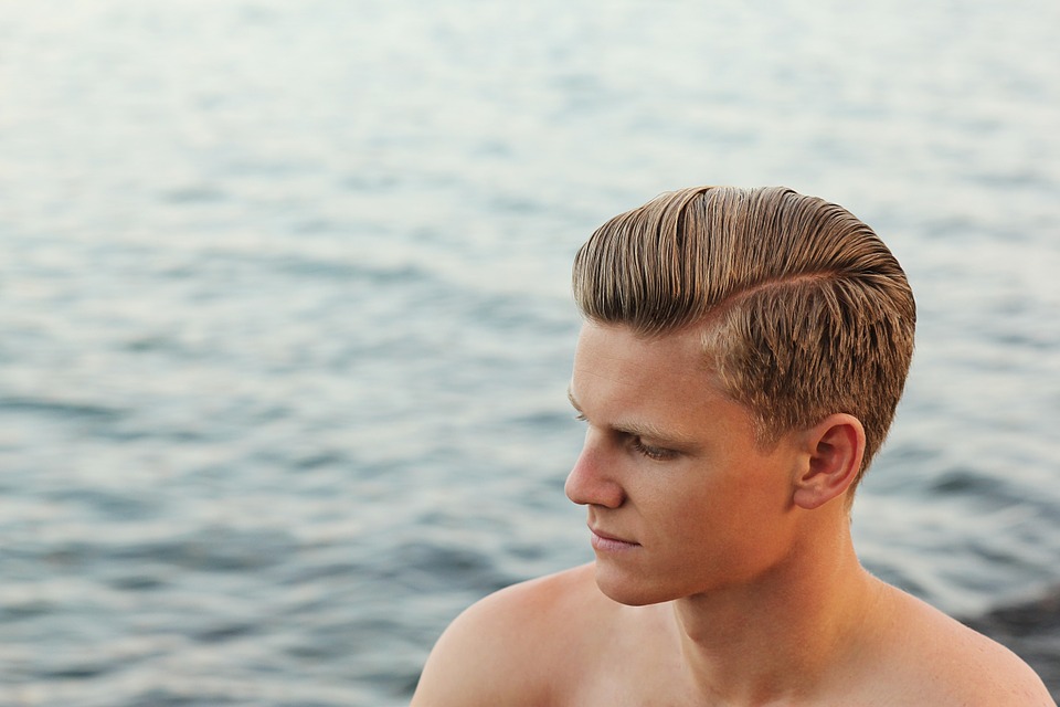 Reference photo for drawing slicked back hair with an off-center parting on a manga man